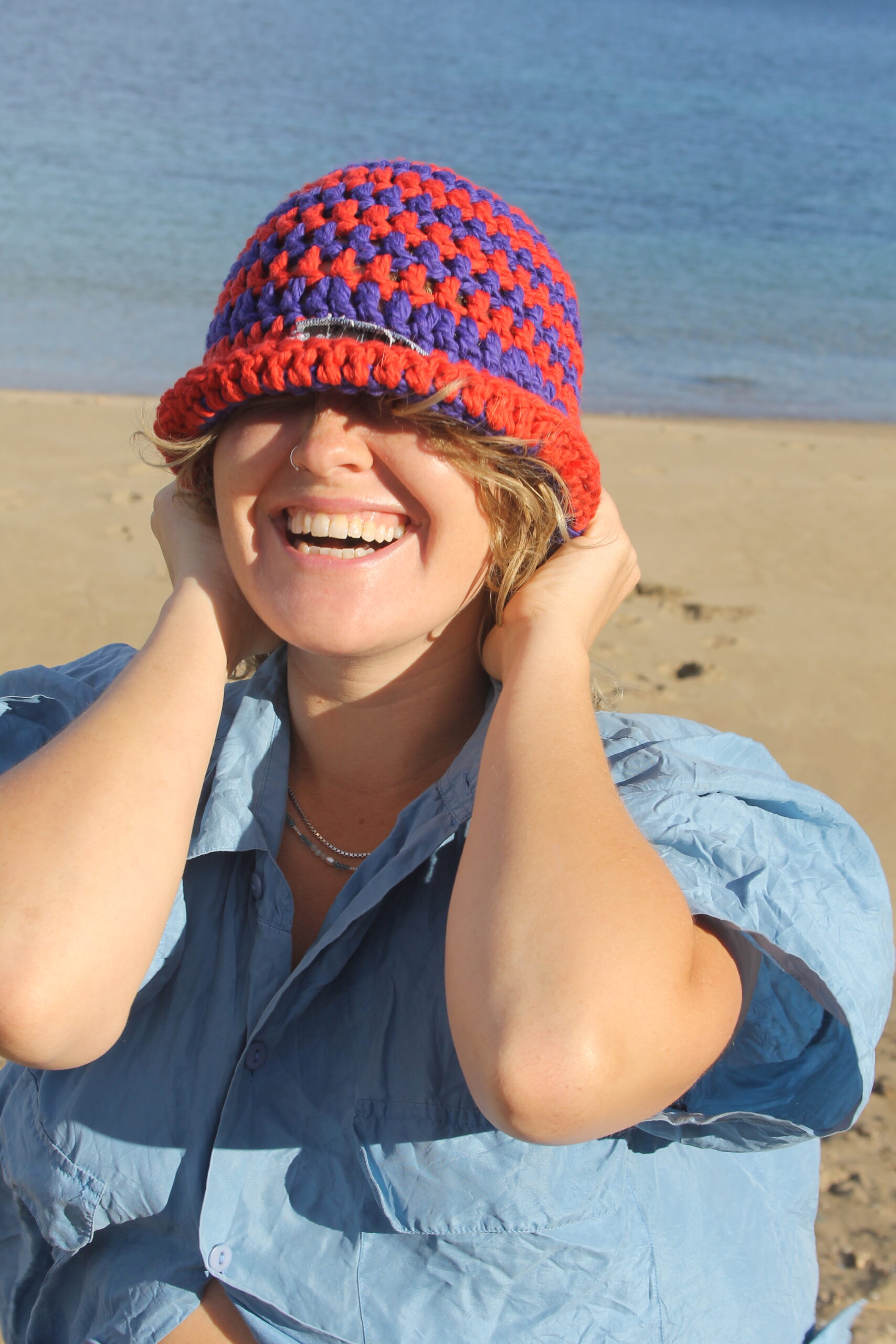 woman with sustainable crochet hat